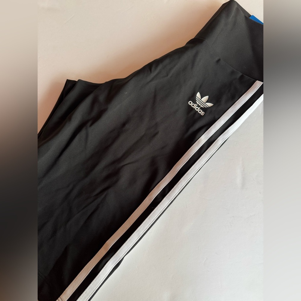 Adidas new with tags high ride standard length women’s biker shorts. Size XS.